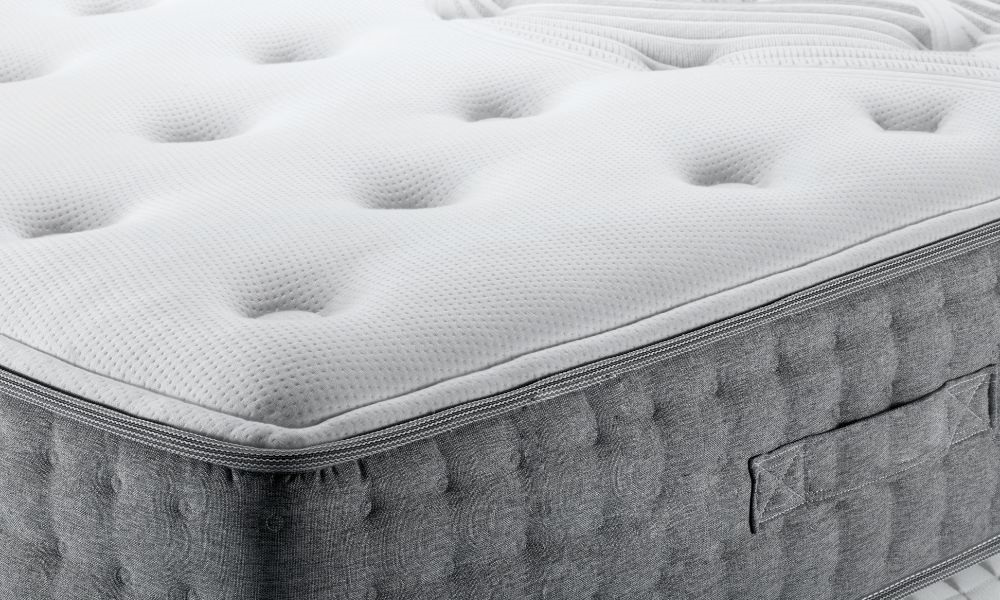 An image with a corner of the grey and white colored matterss