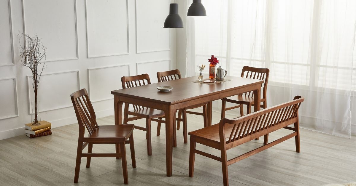 By the window, wooden living Room table with 6 chairs around